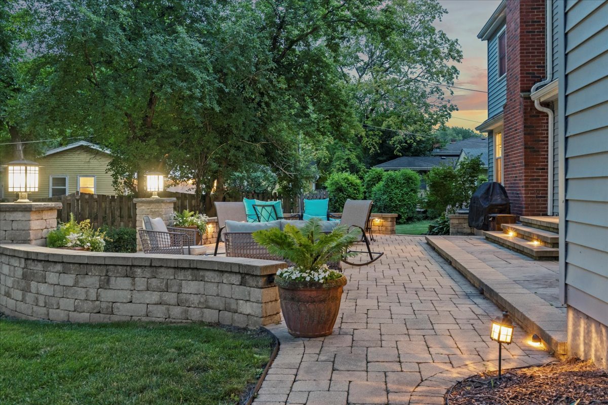 1713 East Thomas Road Wheaton, IL 60187 - Photo 47 of 55 a view of a patio with chair and tables back yard of the house