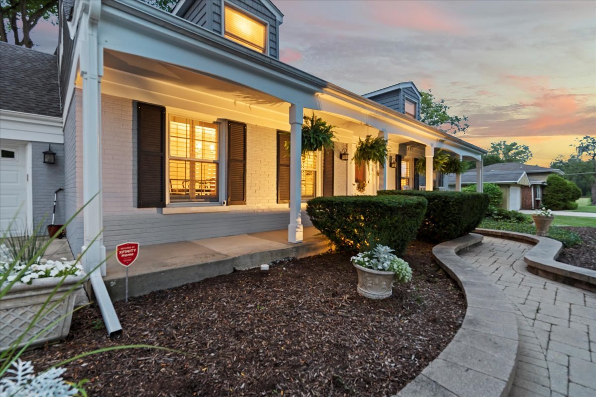 1713 East Thomas Road Wheaton, IL 60187 - Photo 5 of 55 a front view of a house with a yard