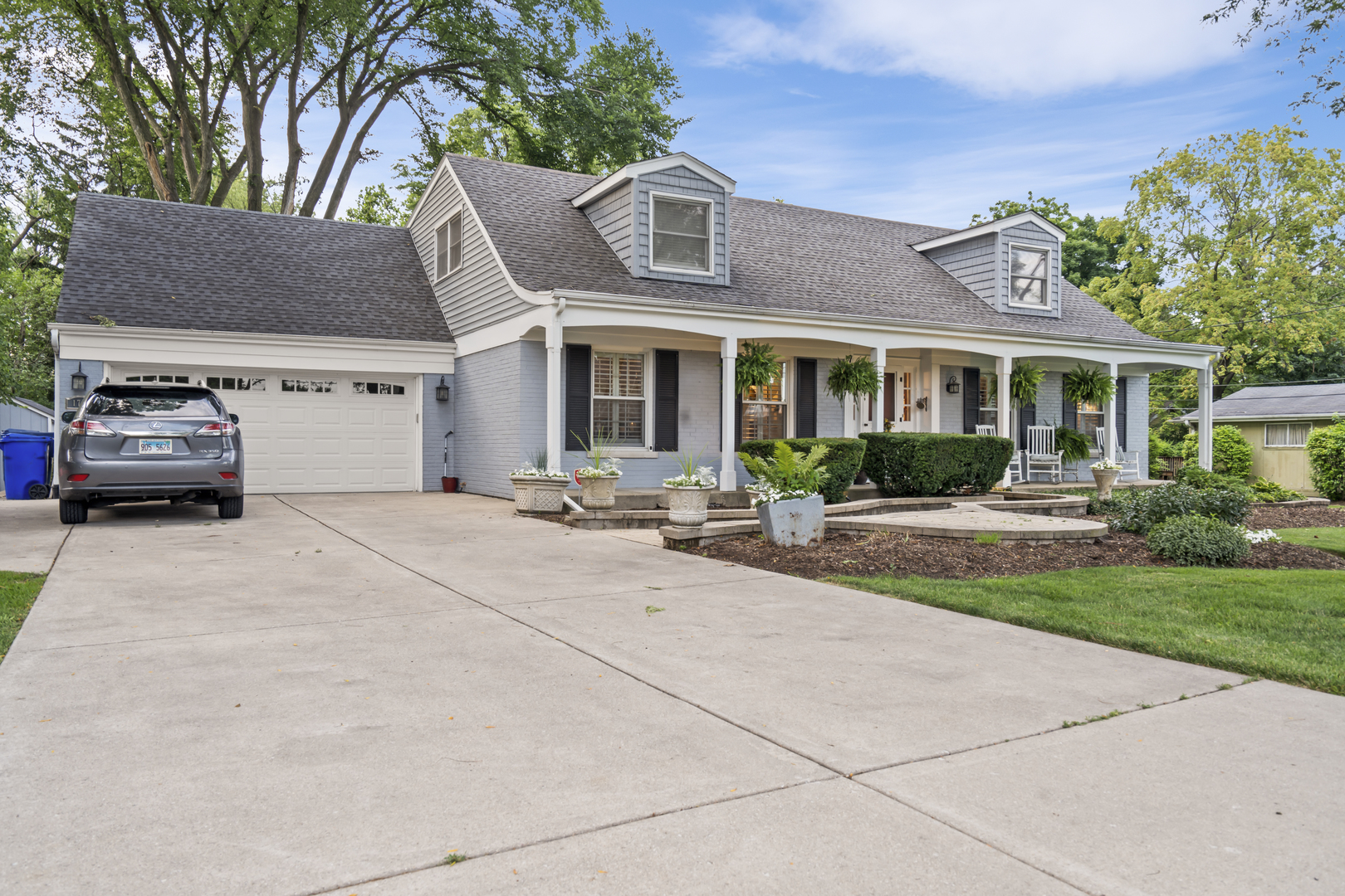 1713 East Thomas Road Wheaton, IL 60187 - Photo 6 of 55 a view of a car parked in front of a brick house