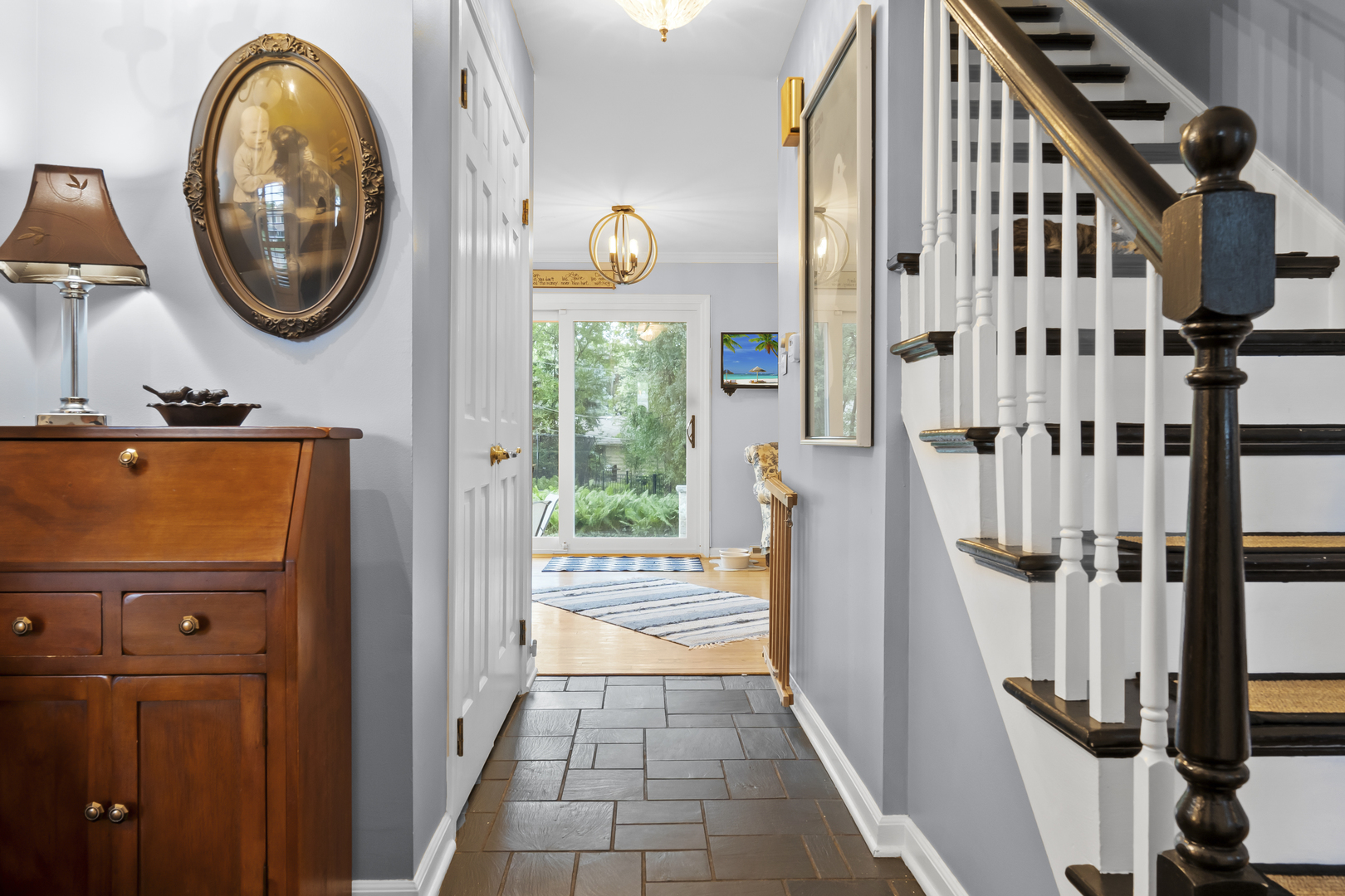 1713 East Thomas Road Wheaton, IL 60187 - Photo 8 of 55 a view of a entryway with wooden floor and furniture