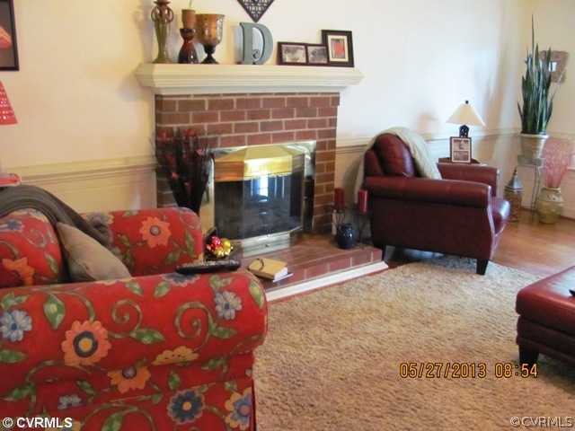 3507 Ludgate Road Chester, VA 23831 - Photo 6 of 12 a living room with furniture and a fireplace