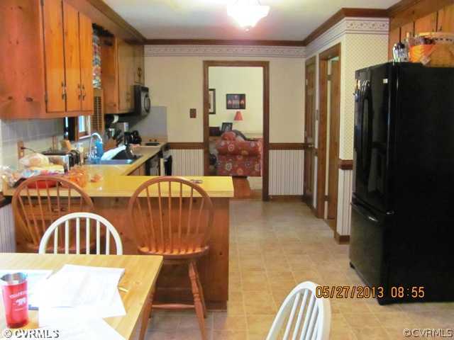 3507 Ludgate Road Chester, VA 23831 - Photo 8 of 12 a view of kitchen with furniture and refrigerator