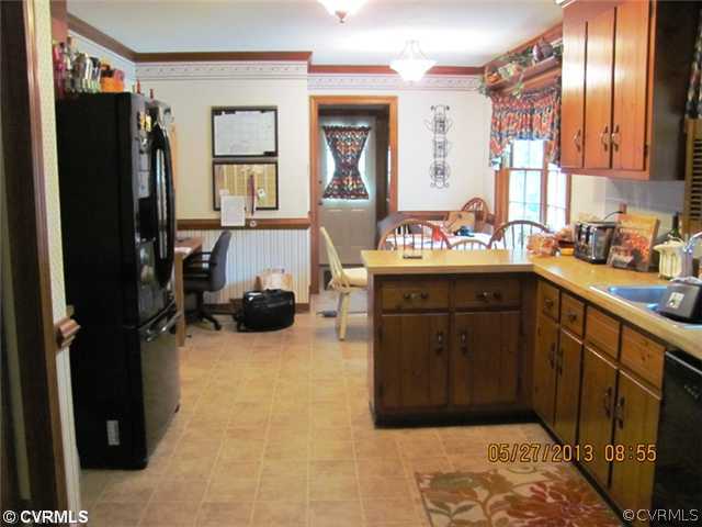 3507 Ludgate Road Chester, VA 23831 - Photo 9 of 12 a kitchen with a sink stove and refrigerator