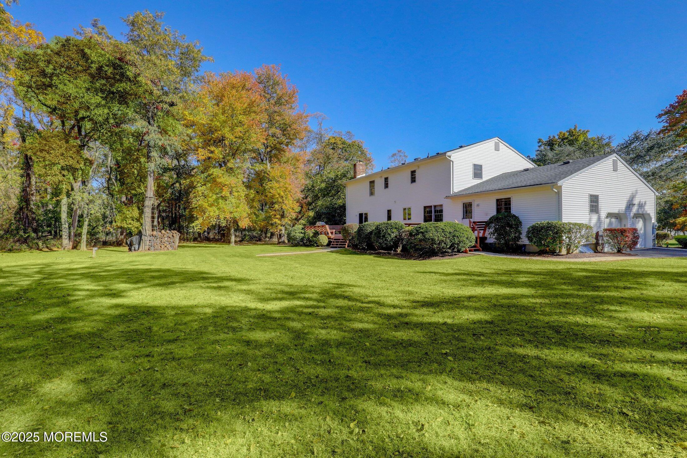 10 Holly Hill Road Marlboro, NJ 07746 - Photo 13 of 19 a front view of house with yard and green space
