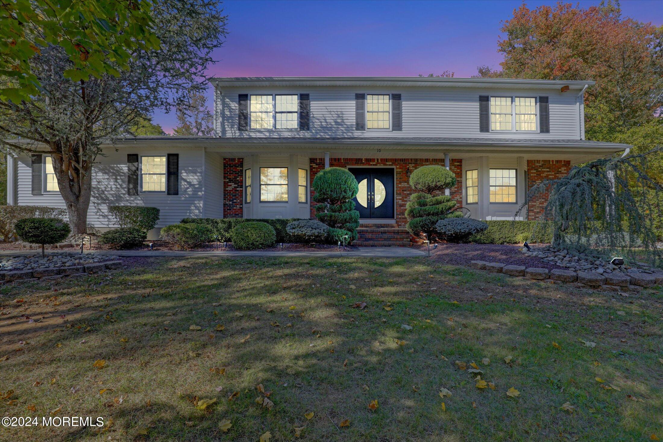 10 Holly Hill Road Marlboro, NJ 07746 - Photo 19 of 19 a front view of a house with garden