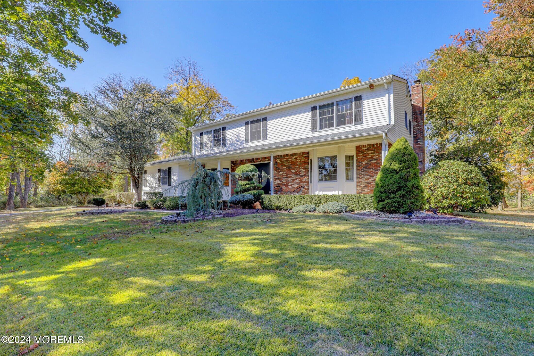 10 Holly Hill Road Marlboro, NJ 07746 - Photo 5 of 19 a view of a building with a yard