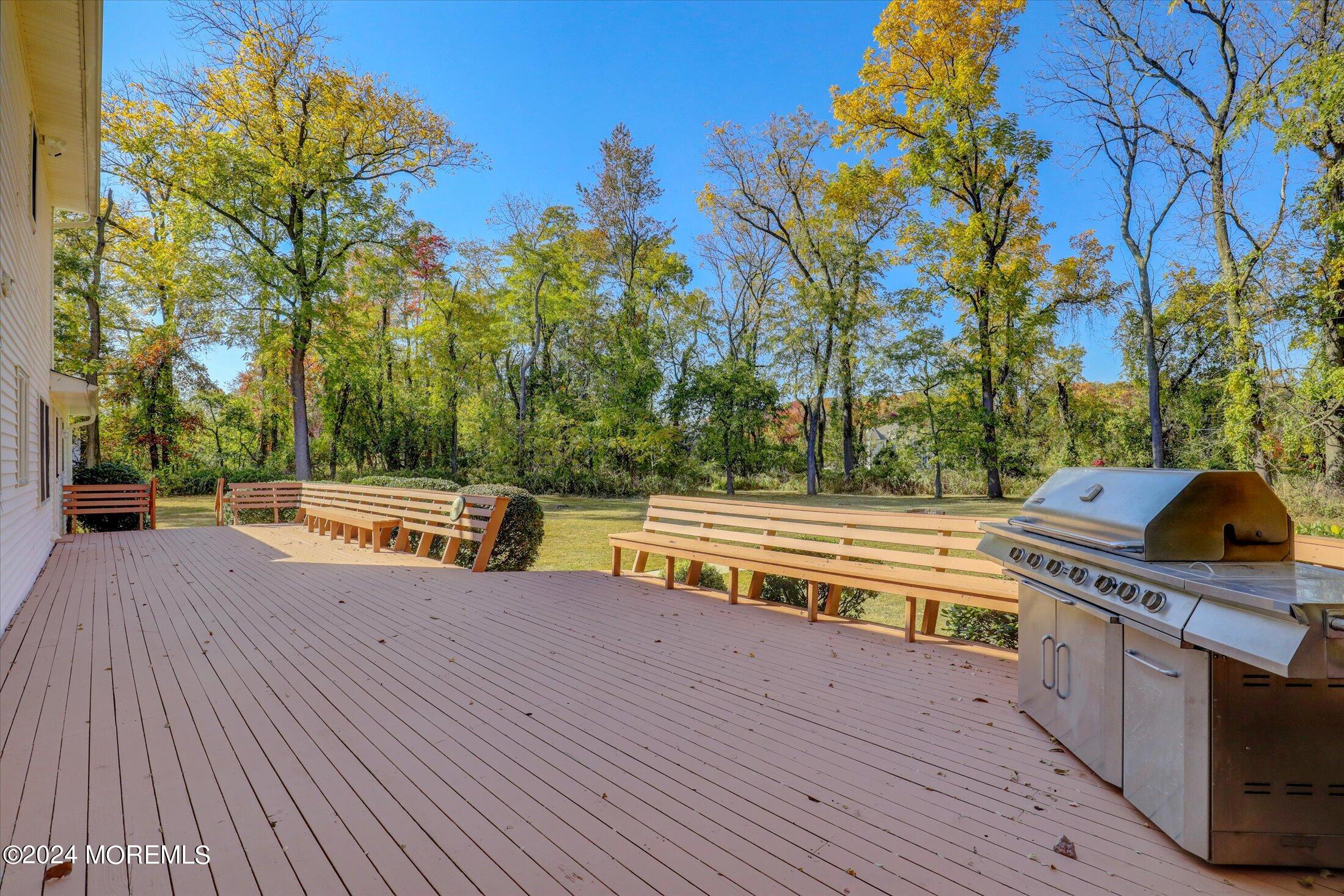 10 Holly Hill Road Marlboro, NJ 07746 - Photo 7 of 19 a view of a house with swimming pool and sitting area
