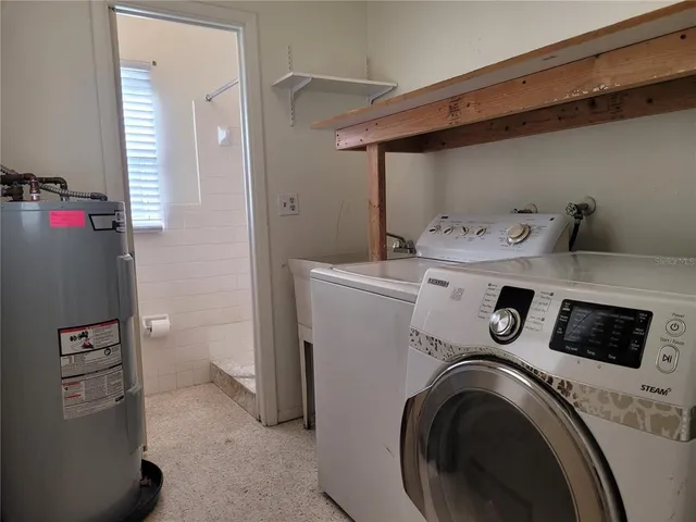 a utility room with dryer and washer