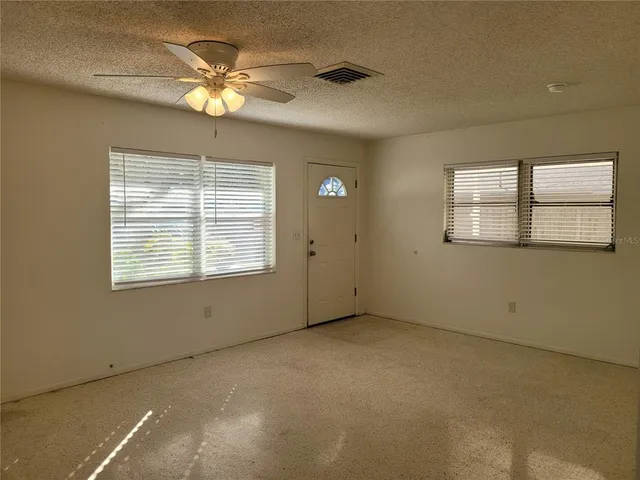 a view of an empty room with a window