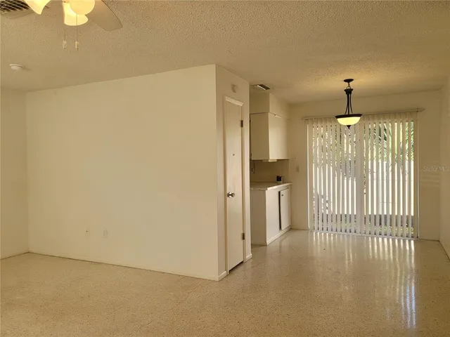 a view of a hallway with a chandelier