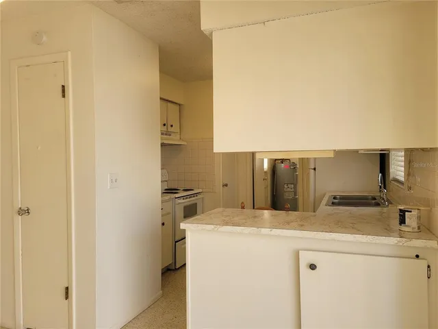 a bathroom with a sink and mirror