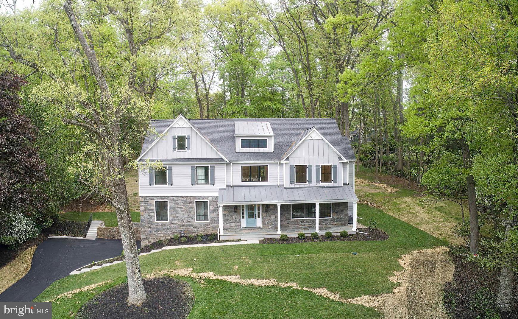 665 Valley View Lane Wayne, PA 19087 - Photo 1 of 34 a front view of a house with a garden