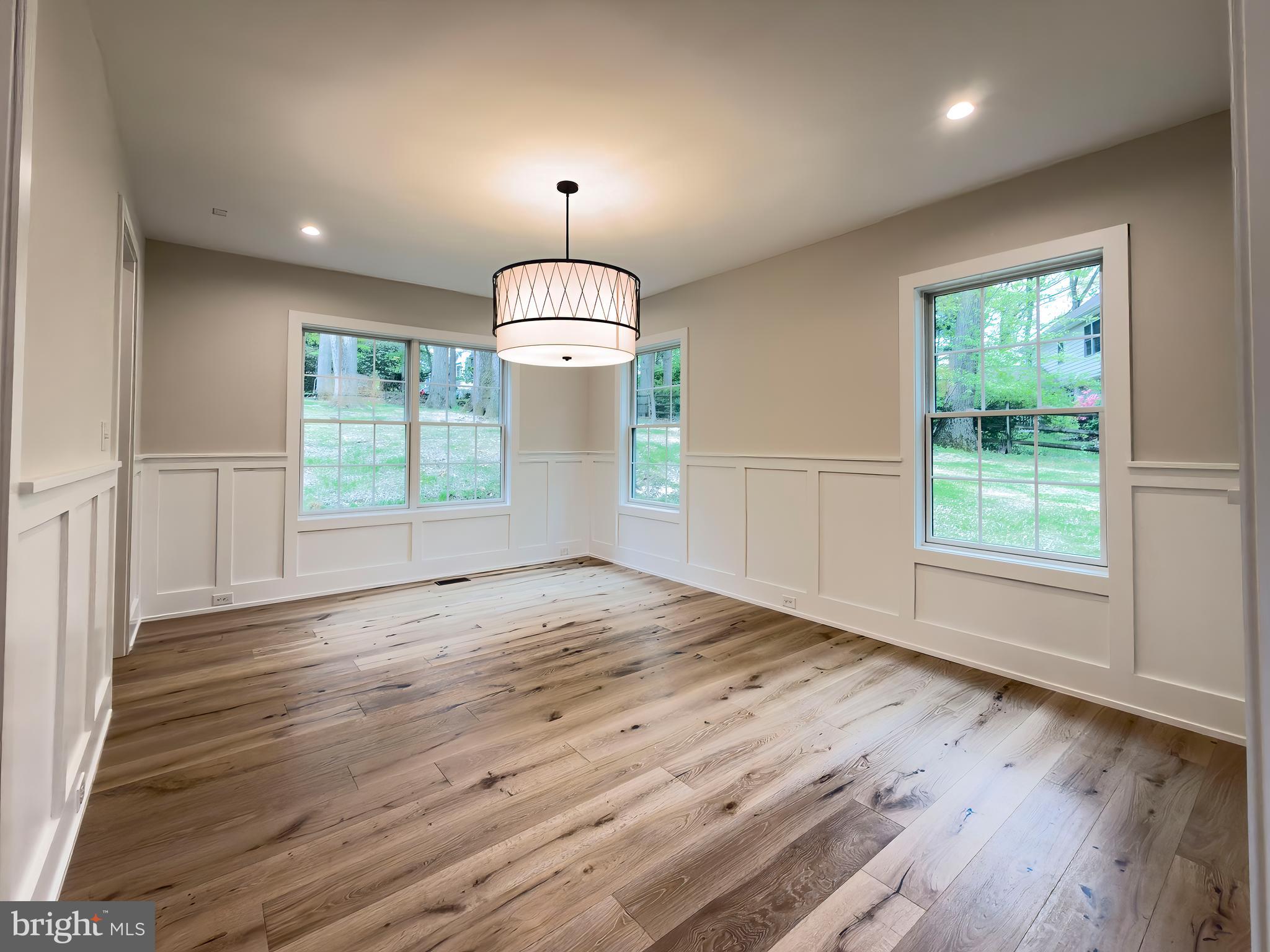 665 Valley View Lane Wayne, PA 19087 - Photo 12 of 34 a view of empty room with wooden floor and chandelier