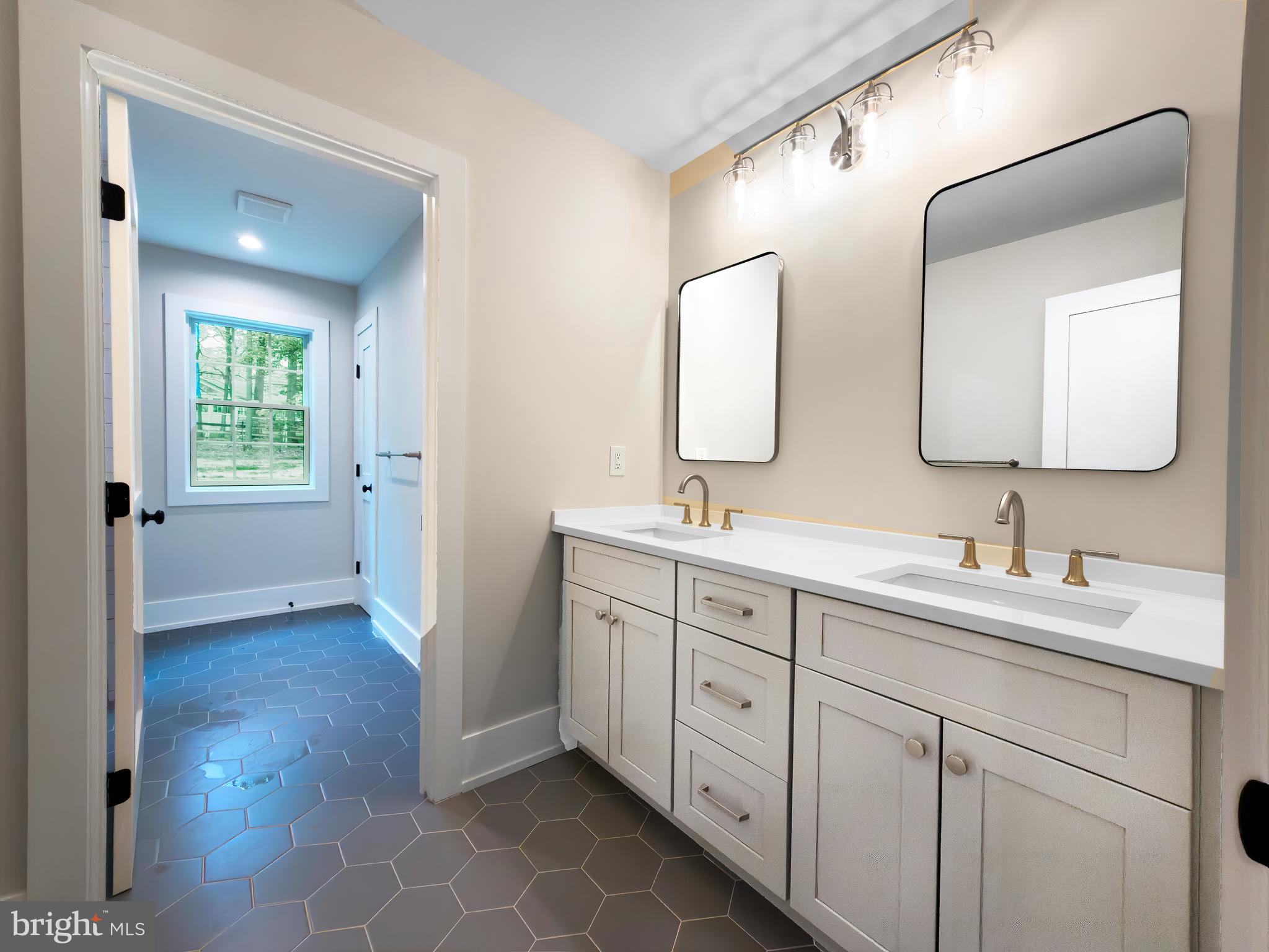 665 Valley View Lane Wayne, PA 19087 - Photo 27 of 34 a bathroom with a double vanity sink mirror and