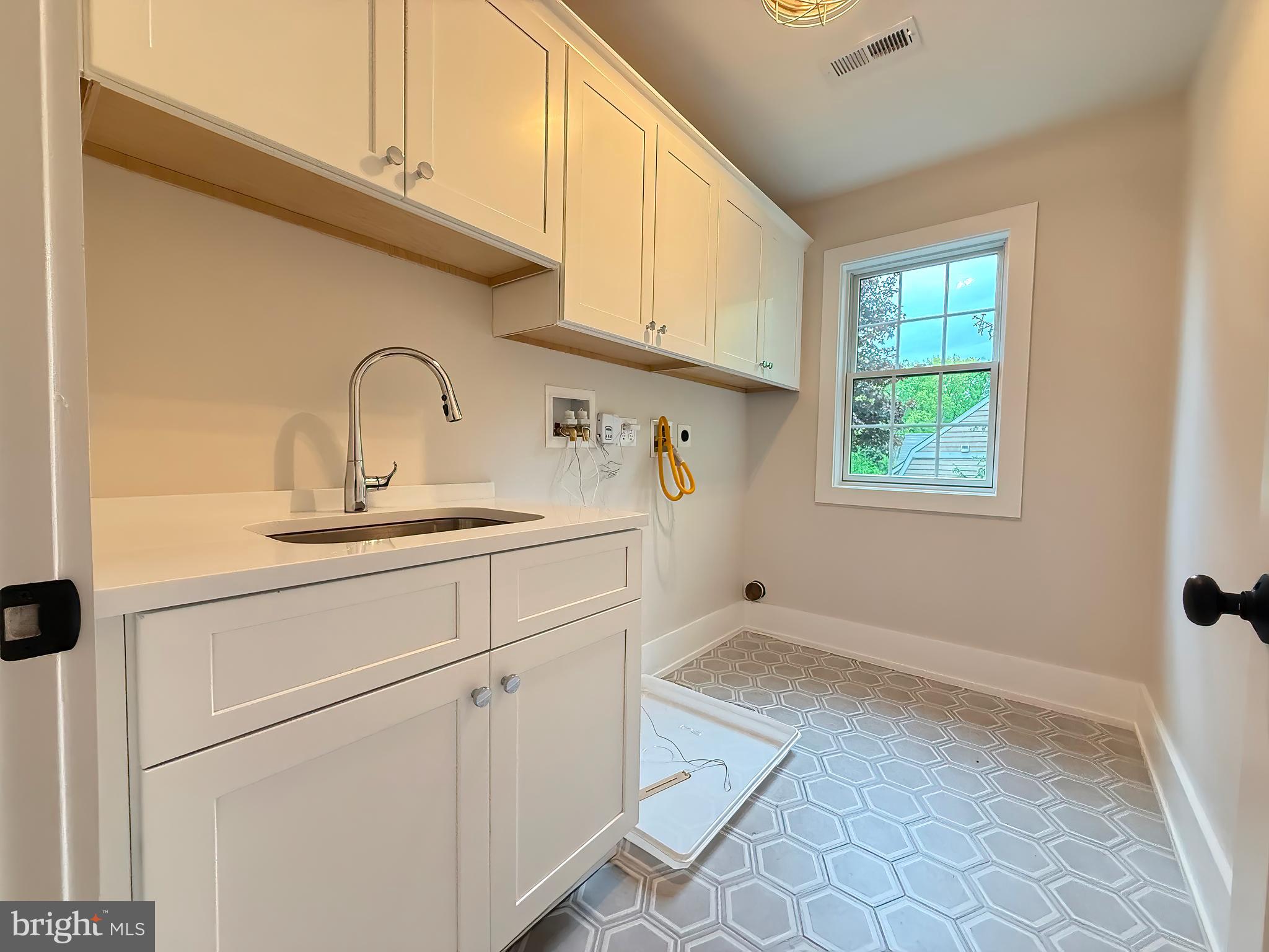 665 Valley View Lane Wayne, PA 19087 - Photo 28 of 34 a kitchen with a sink cabinets and window