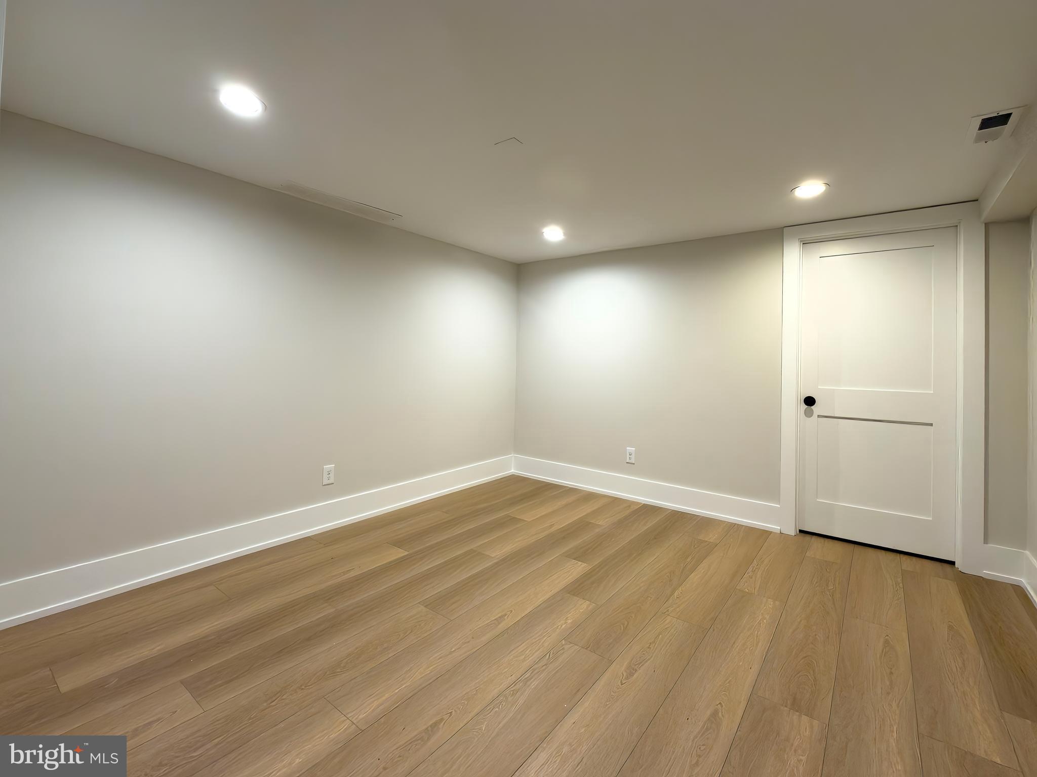665 Valley View Lane Wayne, PA 19087 - Photo 33 of 34 an empty room with wooden floor and windows