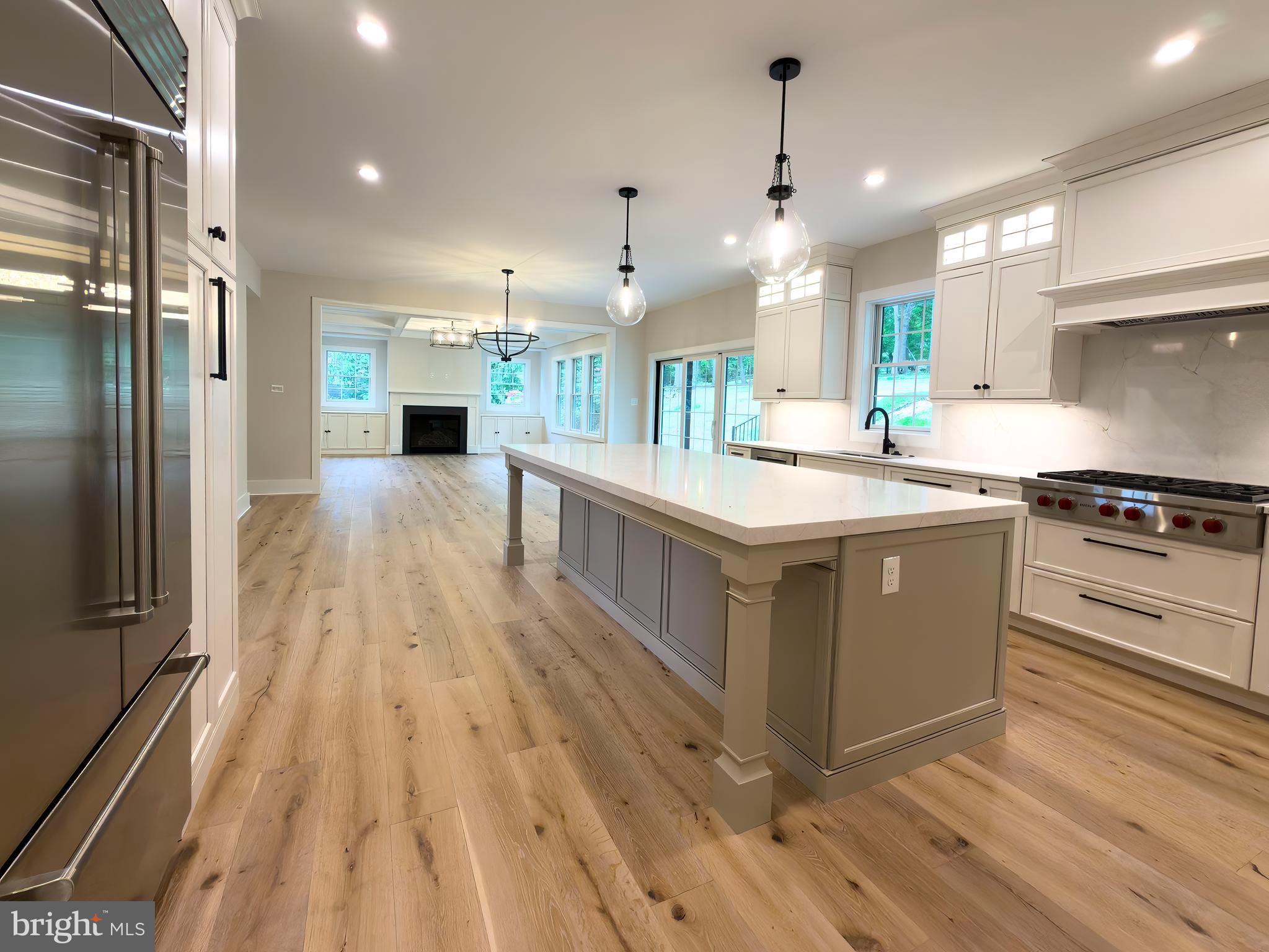 665 Valley View Lane Wayne, PA 19087 - Photo 6 of 34 a kitchen with kitchen island a counter top space a sink stainless steel appliances and cabinets
