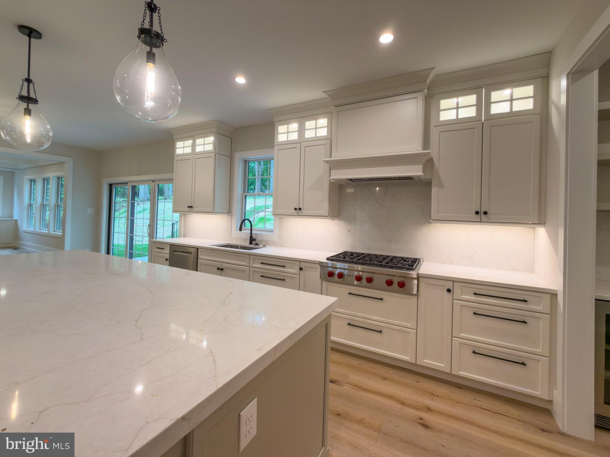 665 Valley View Lane Wayne, PA 19087 - Photo 8 of 34 a kitchen with stove a sink and refrigerator