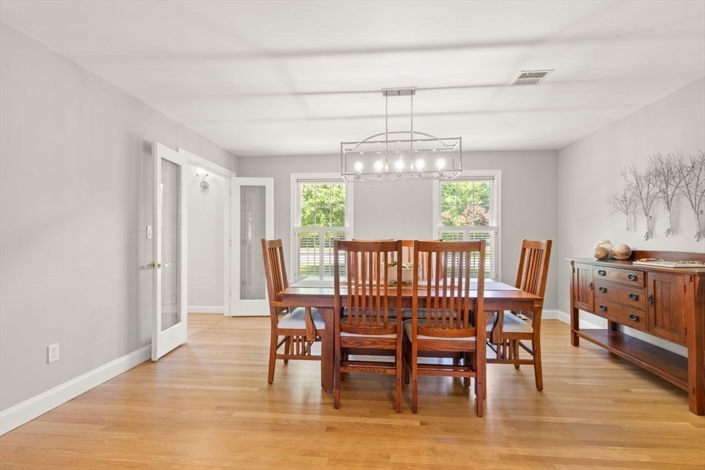 9 Bragg Road Foxboro, MA 02035 - Photo 10 of 42 a view of a dining room with furniture window and wooden floor
