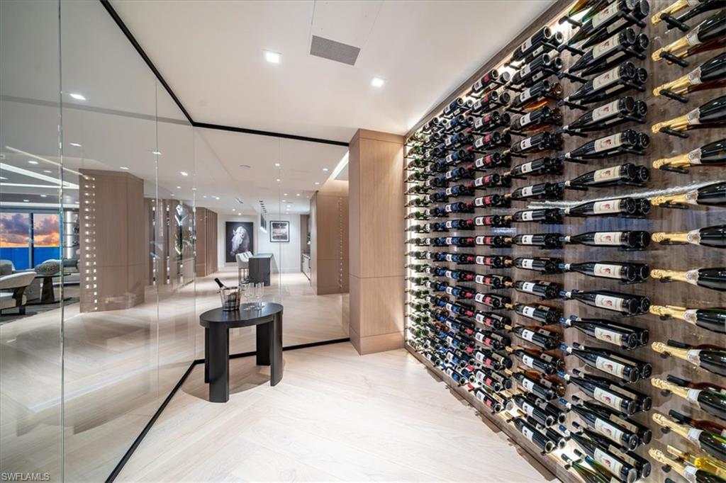 81 Seagate Drive, Unit PH20 Naples, FL 34103 - Photo 11 of 46 a living room with a large window and furniture