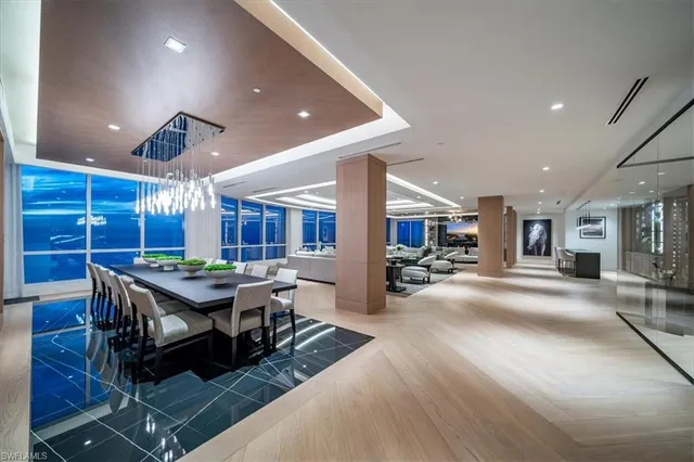 a kitchen with a sink and chandelier