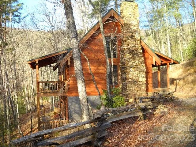a view of a house with a tree