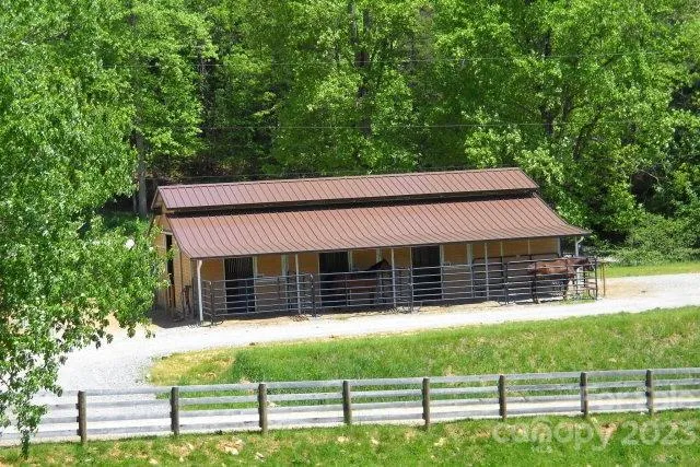 a front view of a house with a fence