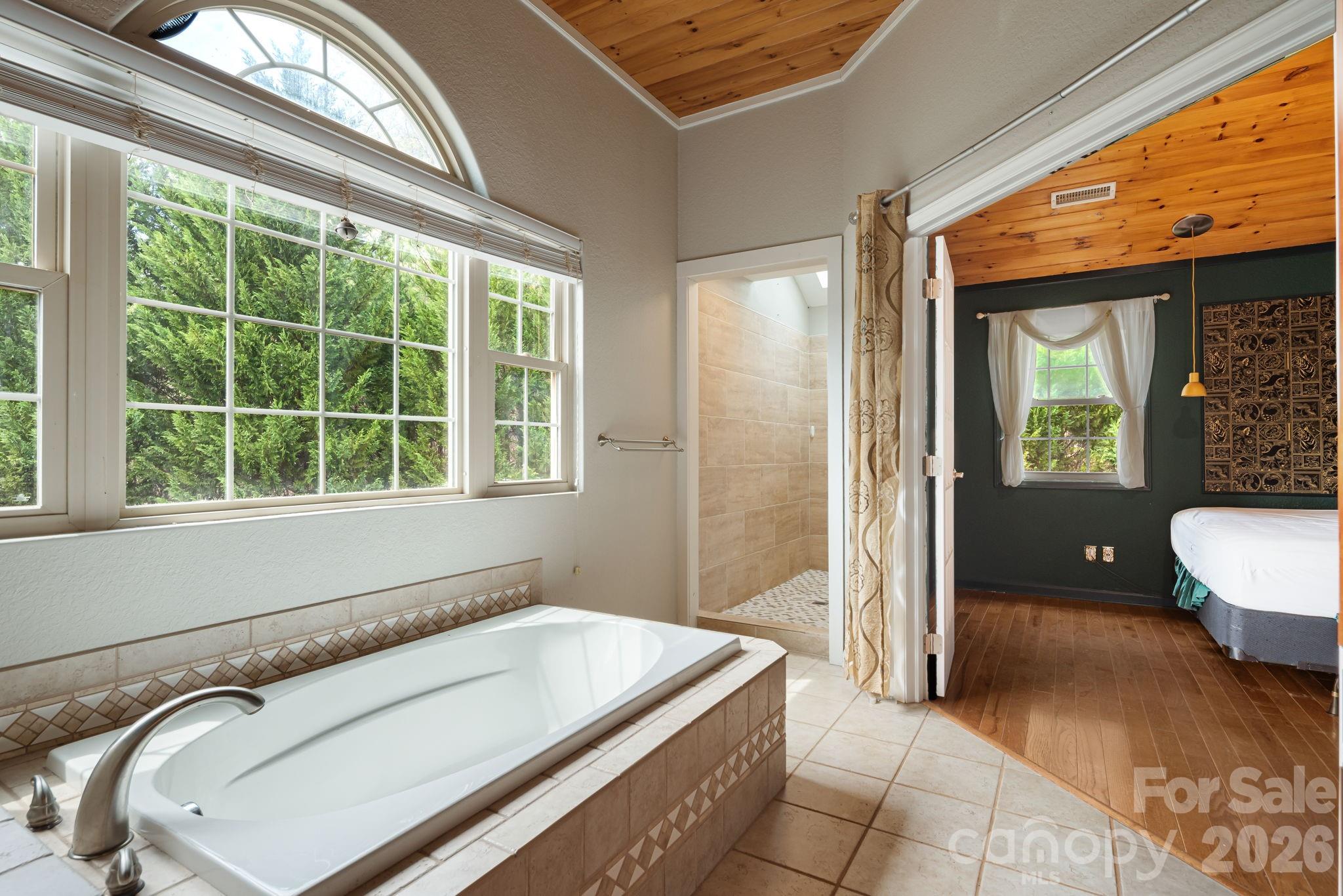 2011 Edgerton Road Mill Spring, NC 28756 - Photo 26 of 31 a spacious bathroom with a tub and large windows