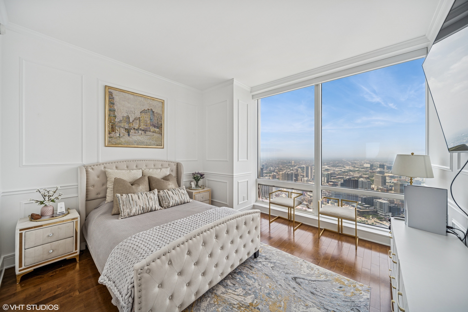 401 North Wabash Avenue, Unit 52C Chicago, IL 60611 - Photo 6 of 20 a spacious bedroom with a large bed and a couch