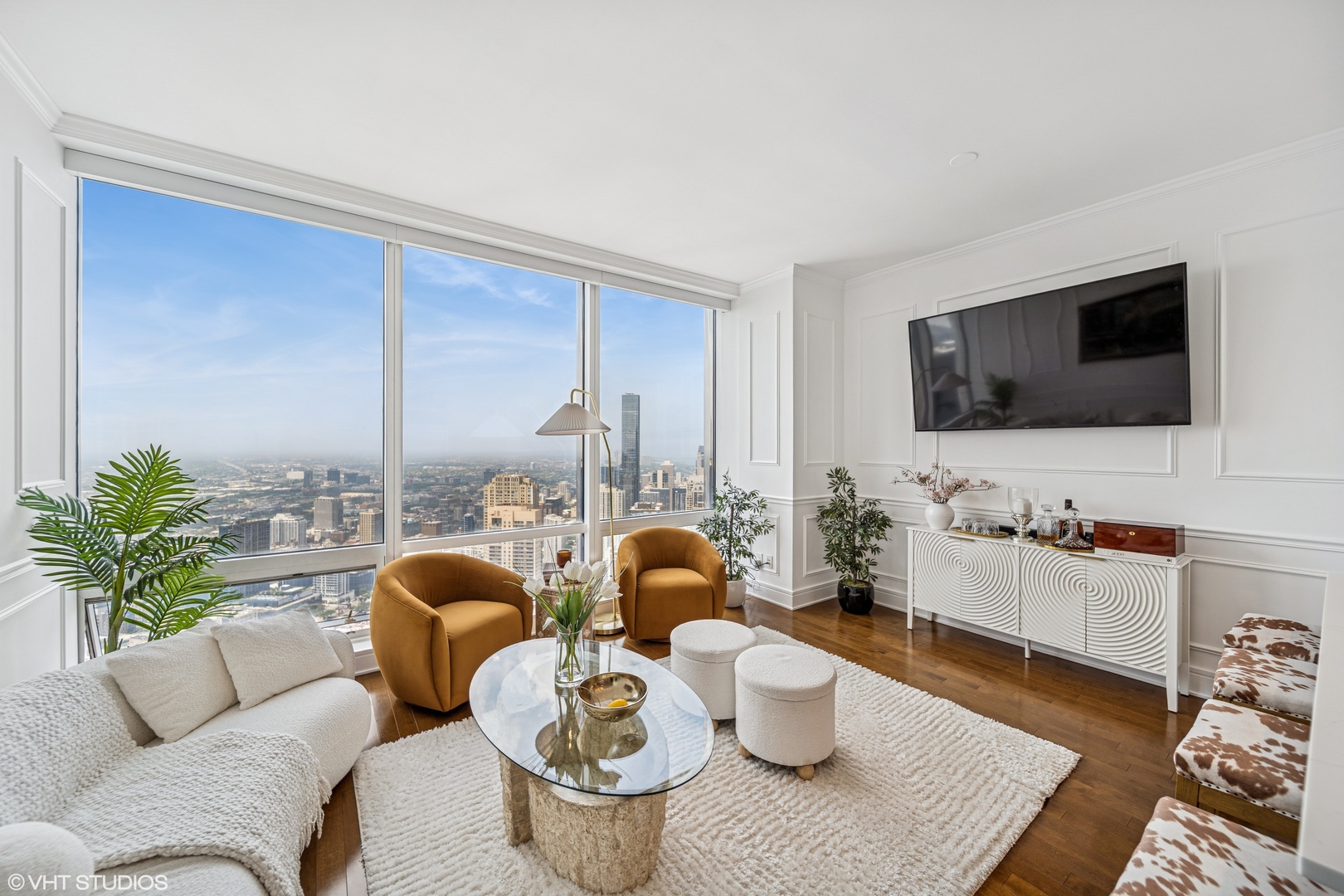 401 North Wabash Avenue, Unit 52C Chicago, IL 60611 - Photo 7 of 20 a living room with furniture and a flat screen tv