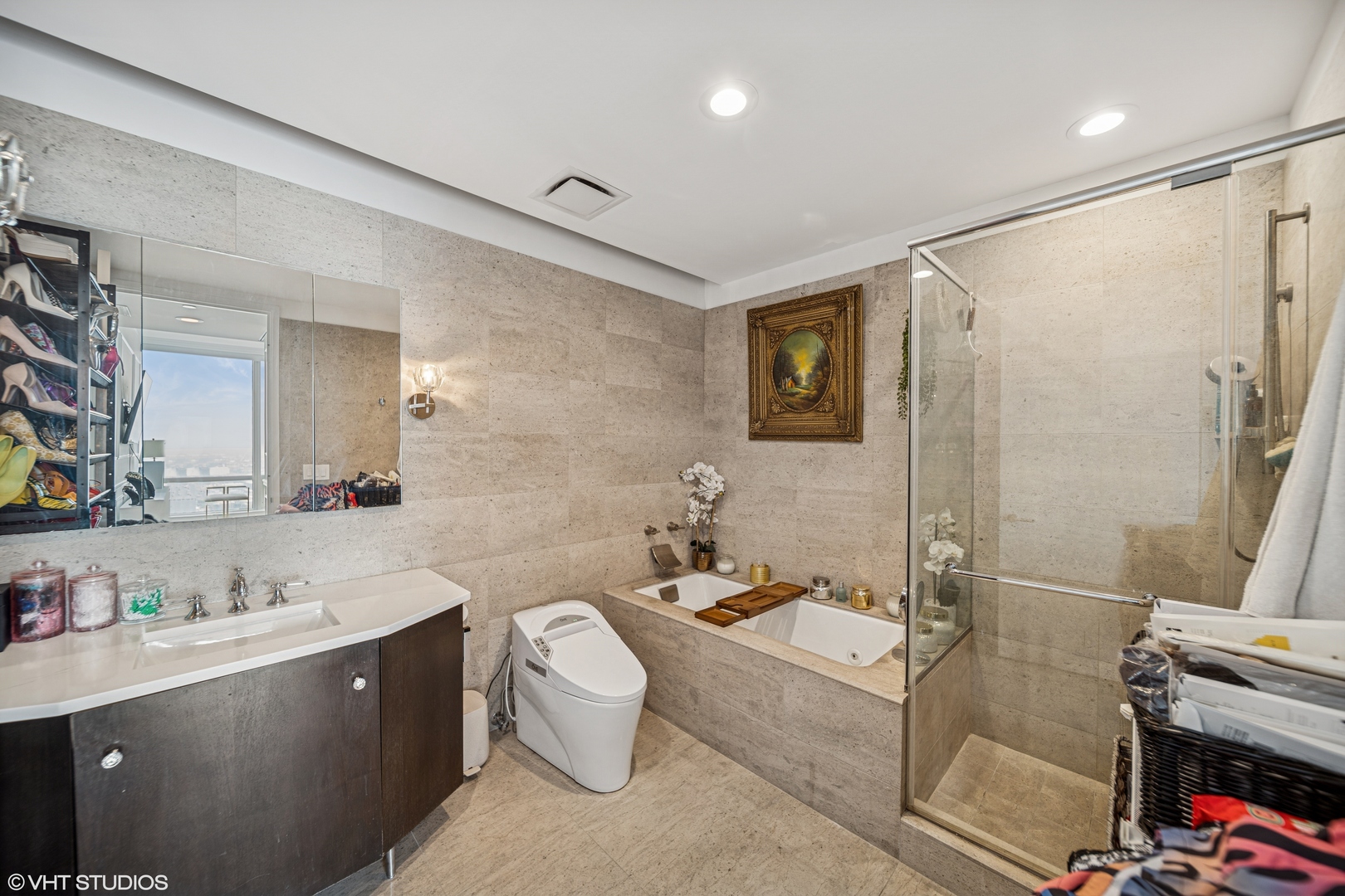 401 North Wabash Avenue, Unit 52C Chicago, IL 60611 - Photo 8 of 20 a spacious bathroom with a double vanity sink toilet mirror and bathtub