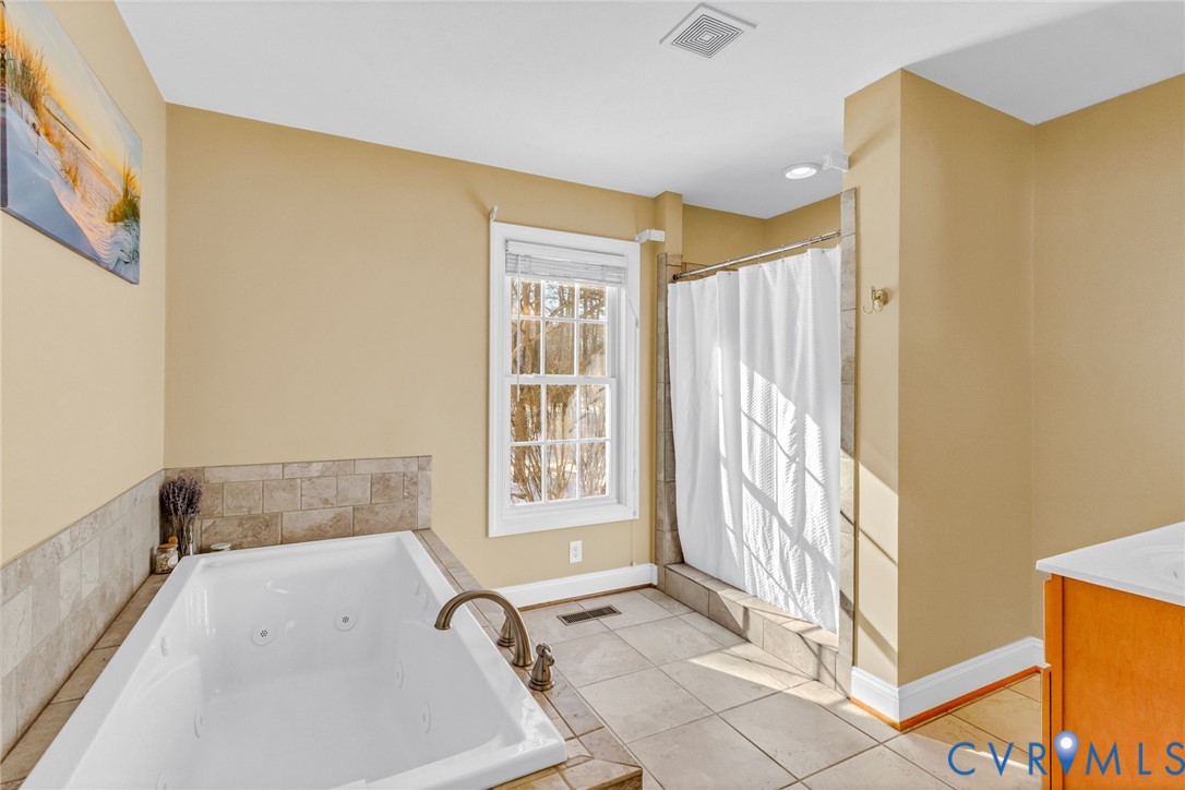 43 Ruddy Duck Road Heathsville, VA 22473 - Photo 25 of 46 a bath room with a tub and a window