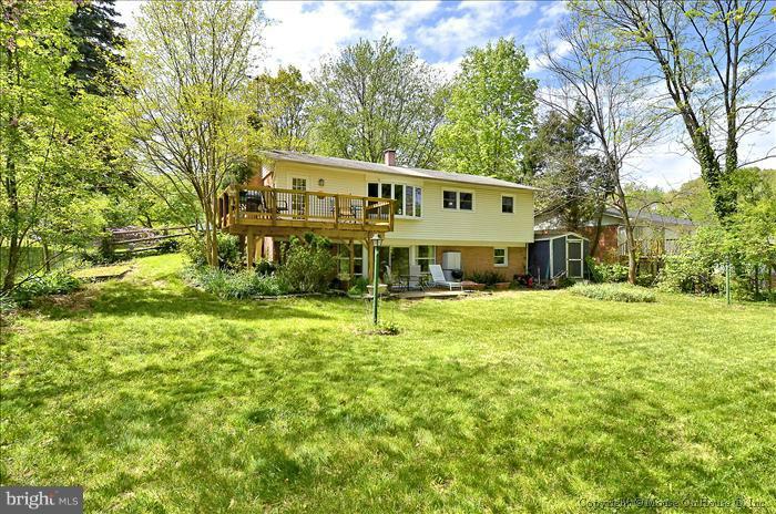 2604 Woodedge Road Silver Spring, MD 20906 - Photo 12 of 30 a view of a house with a large trees and a big yard