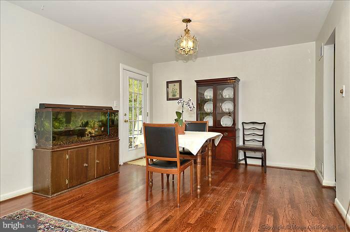2604 Woodedge Road Silver Spring, MD 20906 - Photo 13 of 30 a view of a dining room with furniture and wooden floor