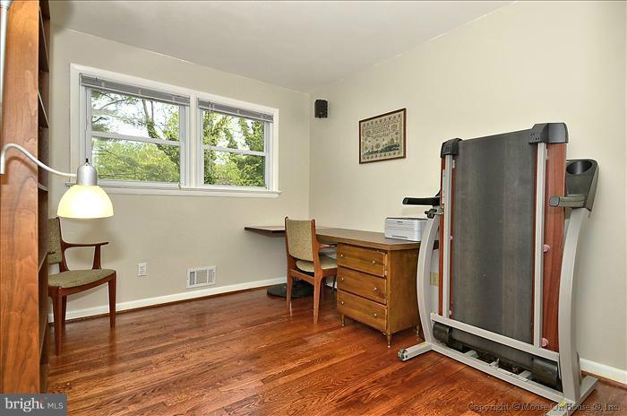 2604 Woodedge Road Silver Spring, MD 20906 - Photo 15 of 30 a view of a livingroom with furniture wooden floor and a window