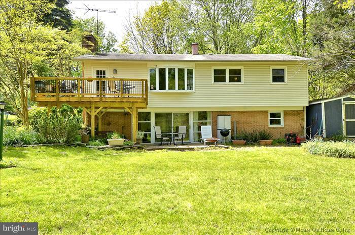 2604 Woodedge Road Silver Spring, MD 20906 - Photo 18 of 30 a view of a house with a yard and sitting area