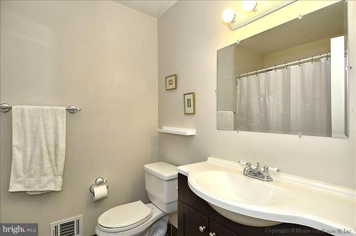 2604 Woodedge Road Silver Spring, MD 20906 - Photo 19 of 30 a bathroom with a sink toilet and a mirror