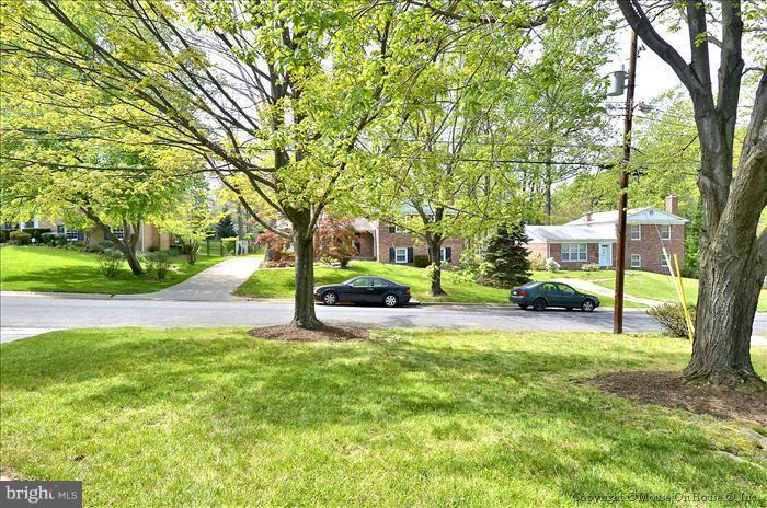 2604 Woodedge Road Silver Spring, MD 20906 - Photo 22 of 30 a view of a house with backyard and a tree