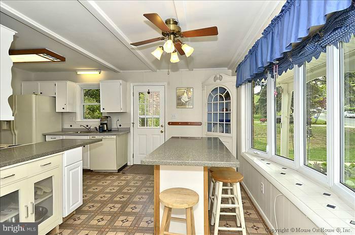 2604 Woodedge Road Silver Spring, MD 20906 - Photo 25 of 30 a open kitchen with a large window appliances and cabinets