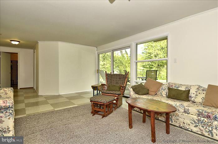 2604 Woodedge Road Silver Spring, MD 20906 - Photo 29 of 30 a living room with furniture and a window