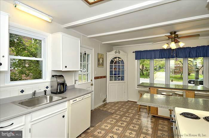 2604 Woodedge Road Silver Spring, MD 20906 - Photo 5 of 30 a kitchen with a sink appliances cabinets and a large window