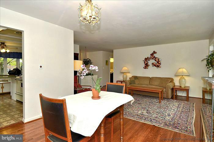 2604 Woodedge Road Silver Spring, MD 20906 - Photo 7 of 30 a dining room with furniture a rug and wooden floor