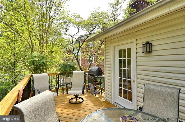 2604 Woodedge Road Silver Spring, MD 20906 - Photo 9 of 30 a view of chair and tables on the deck