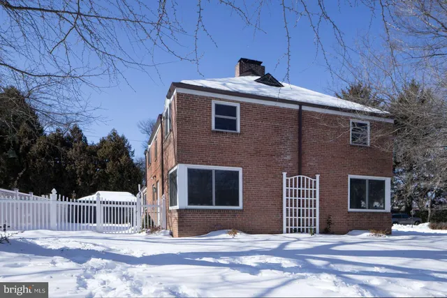 a side view of a house with a garage