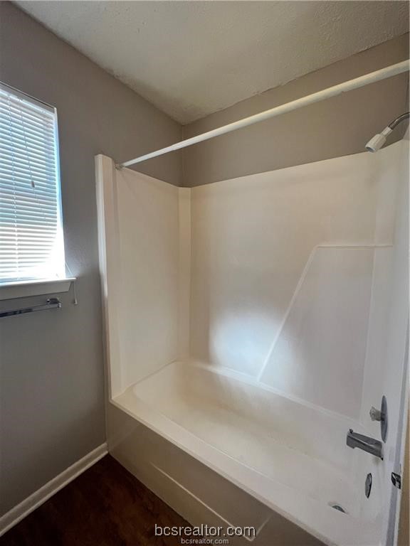 906 Spring Loop, Unit D College Station, TX 77840 - Photo 11 of 11 a bathroom with a shower and a glass door