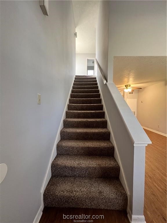 906 Spring Loop, Unit D College Station, TX 77840 - Photo 2 of 11 a view of entryway and hall with wooden floor