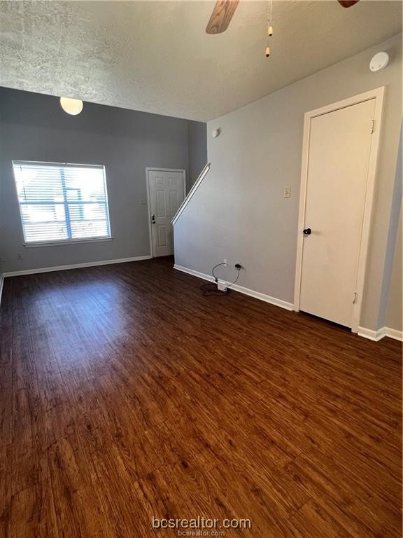 906 Spring Loop, Unit D College Station, TX 77840 - Photo 4 of 11 an empty room with wooden floor and windows