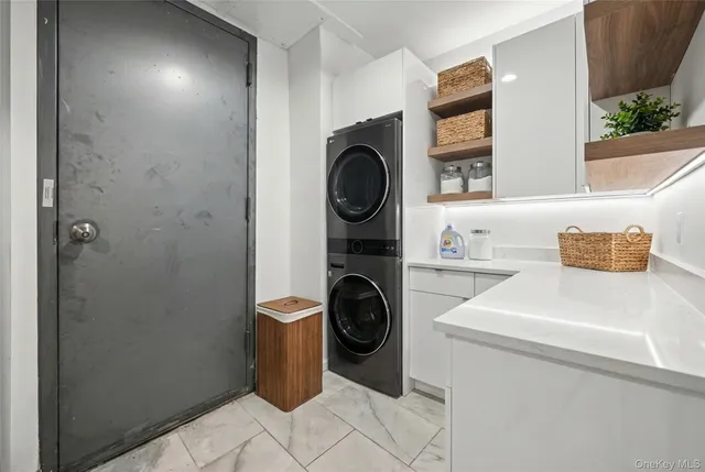 a utility room with sink dryer and washer