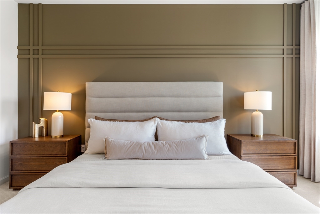 2 Codman Way, Unit 307 Westborough, MA 01581 - Photo 17 of 41 a large bed sitting in a bedroom and lamp