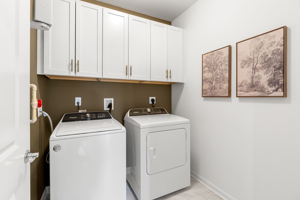 2 Codman Way, Unit 307 Westborough, MA 01581 - Photo 27 of 41 a utility room with dryer and washer